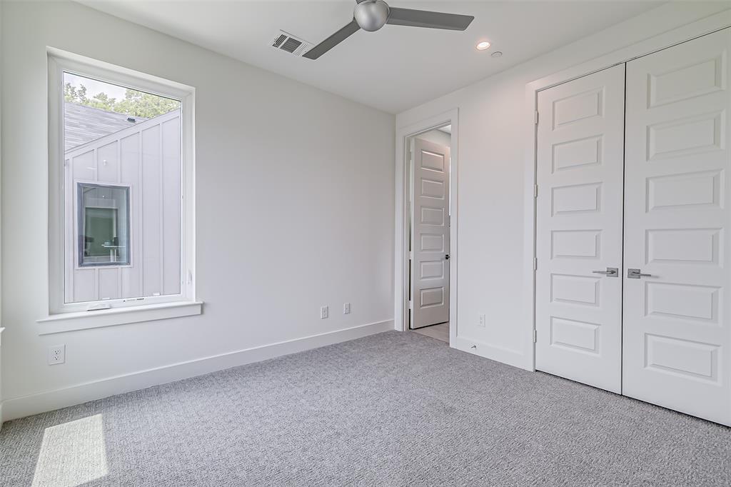 6028 Lewis Street, Unit 204 Dallas, TX 75206 - Photo 35 of 39 an empty room with windows and closet