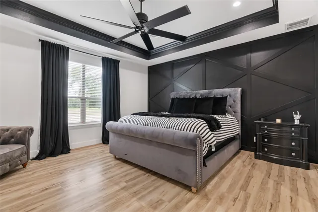 a bedroom with a large bed and a window