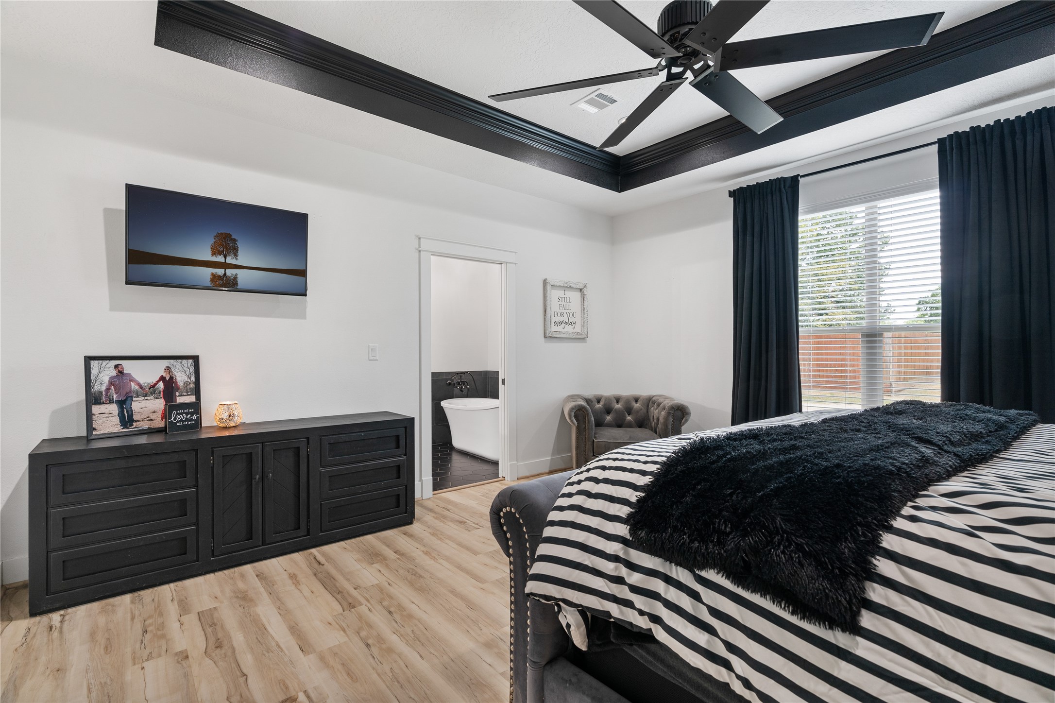 41111 Community Road Magnolia, TX 77354 - Photo 16 of 49 a bedroom with a bed and a dresser