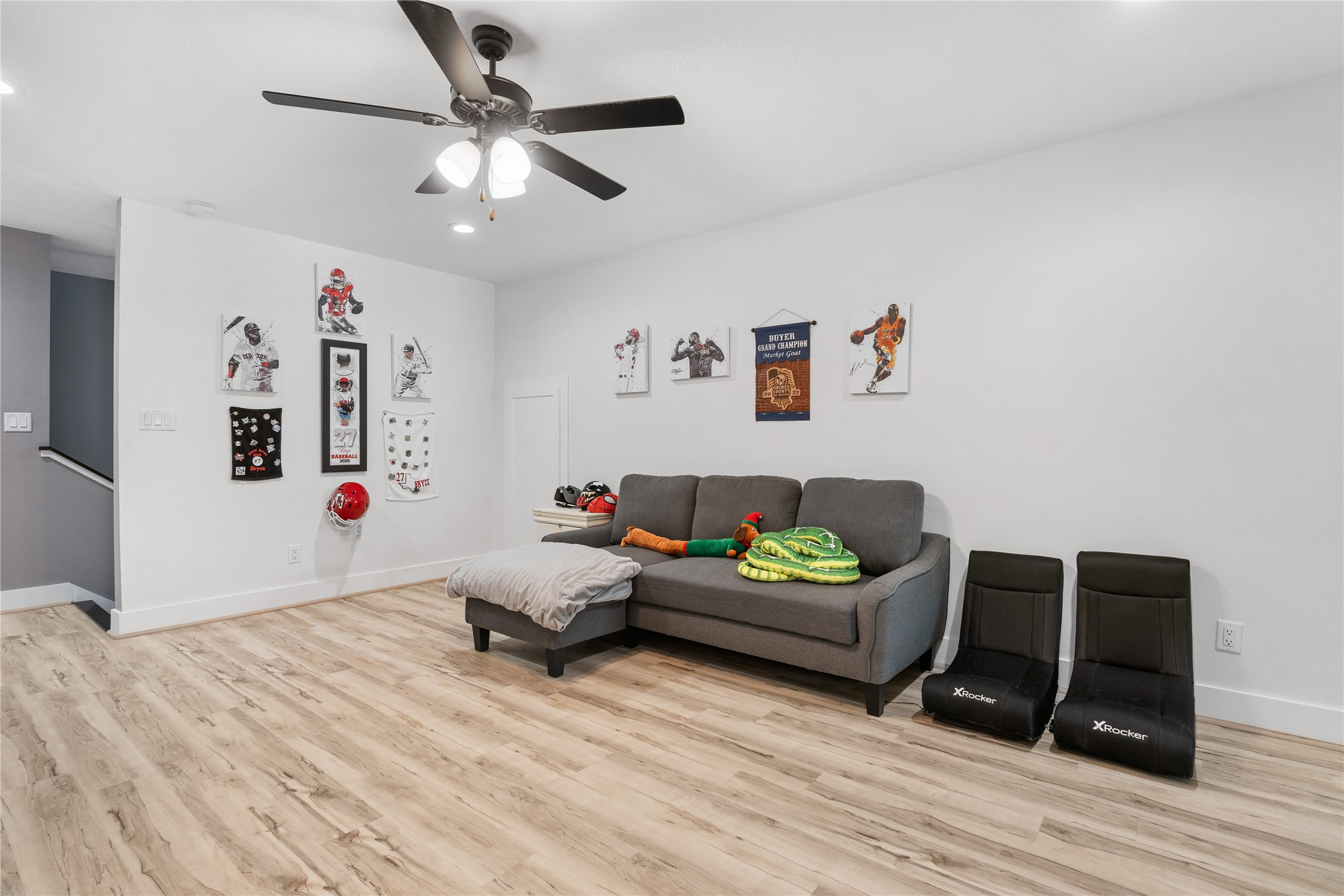 41111 Community Road Magnolia, TX 77354 - Photo 25 of 49 a living room with furniture and a wooden floor