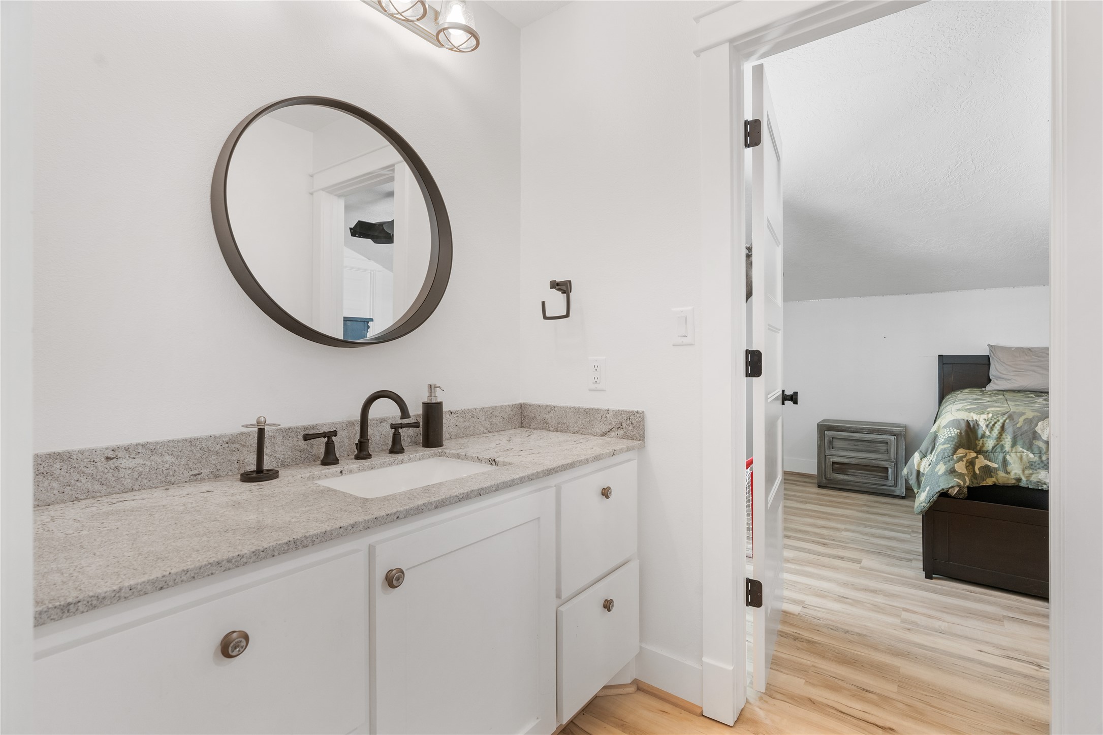 41111 Community Road Magnolia, TX 77354 - Photo 29 of 49 a en suite bathroom with a granite countertop double vanity sink and a mirror