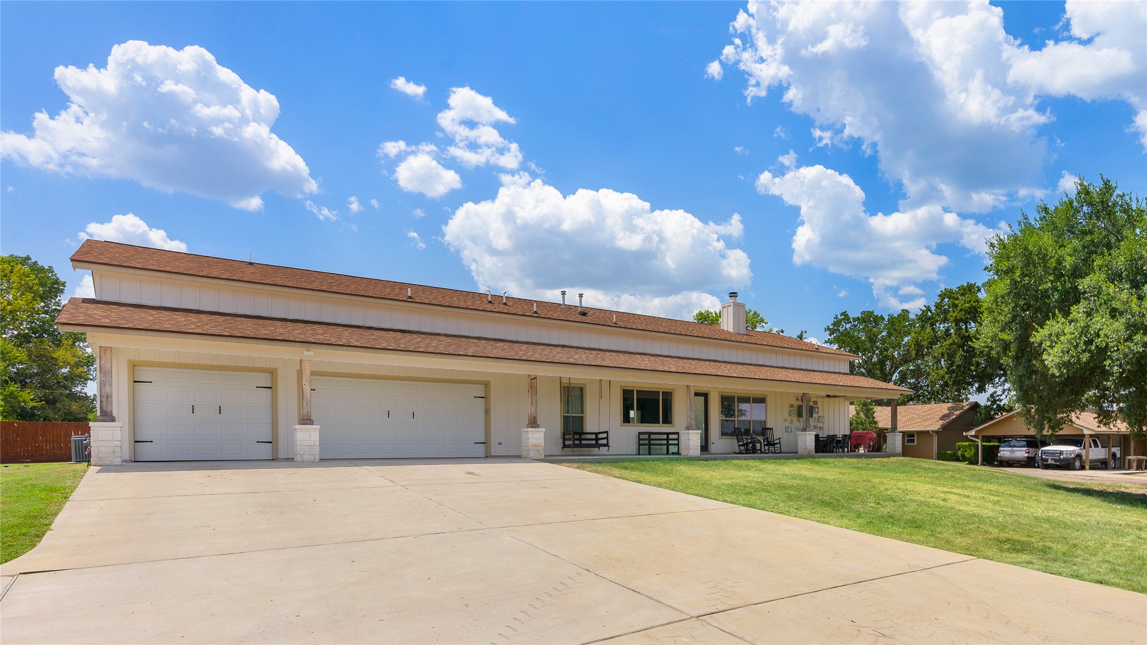 41111 Community Road Magnolia, TX 77354 - Photo 31 of 49 a view of a house with a yard and a garage