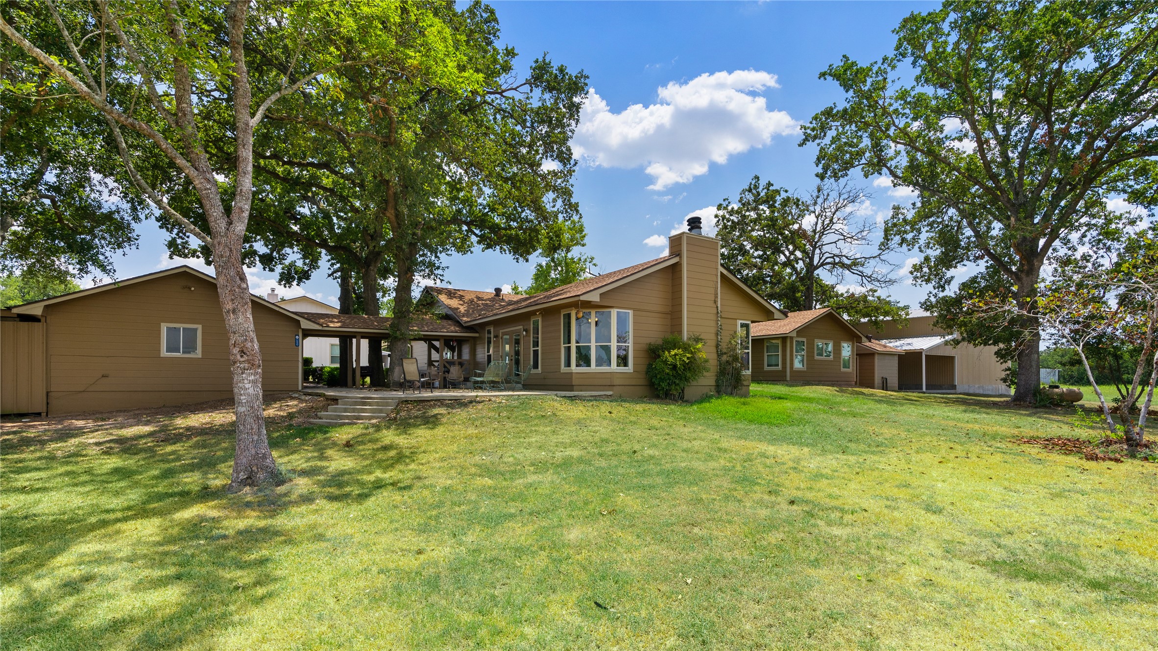 41111 Community Road Magnolia, TX 77354 - Photo 35 of 49 a front view of house with yard and trees