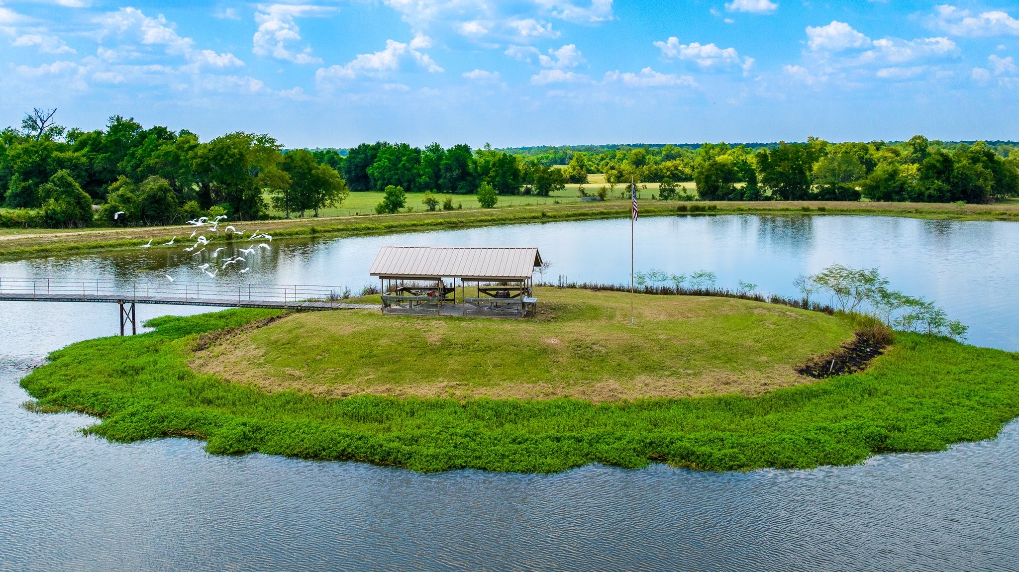 41111 Community Road Magnolia, TX 77354 - Photo 37 of 49 a view of a lake with houses in the back