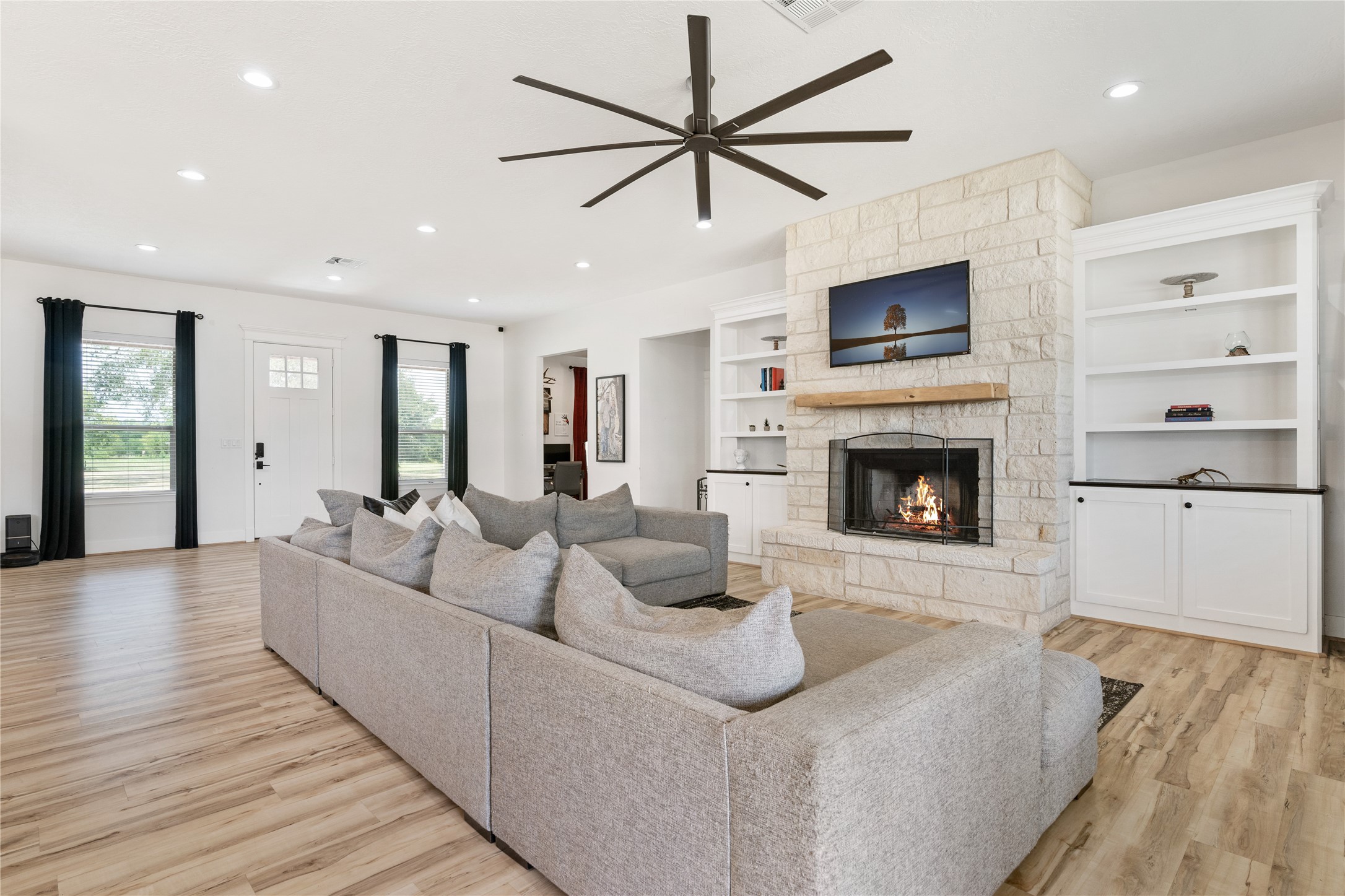 41111 Community Road Magnolia, TX 77354 - Photo 7 of 49 a living room with furniture and a fireplace