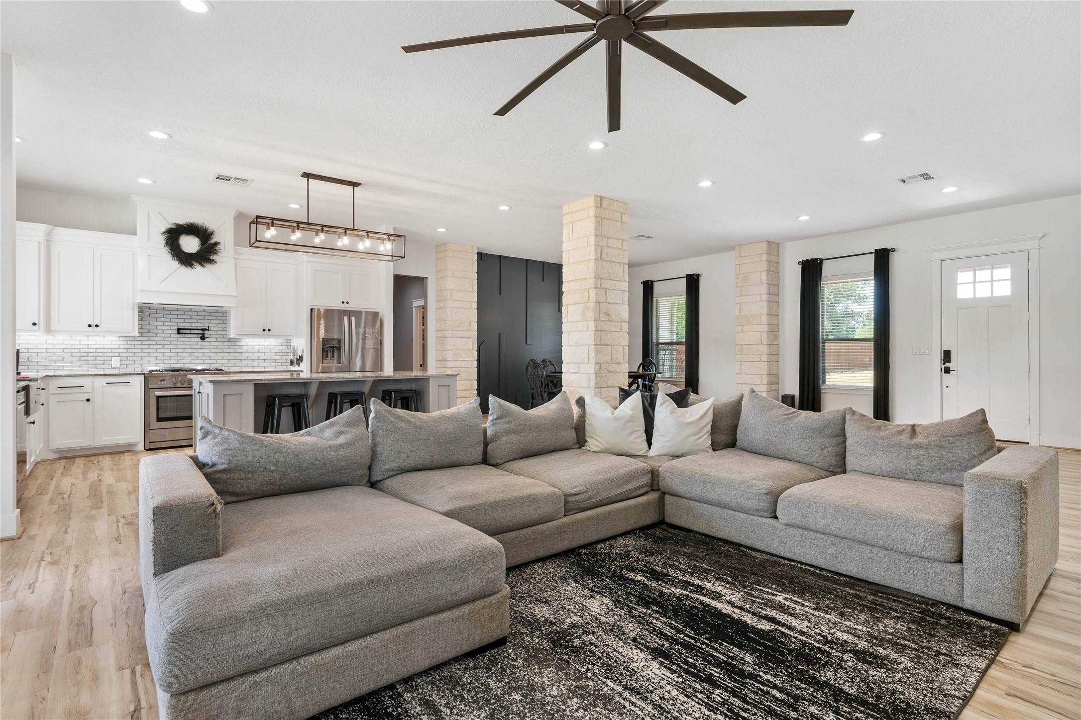41111 Community Road Magnolia, TX 77354 - Photo 8 of 49 a living room with furniture kitchen view and a chandelier