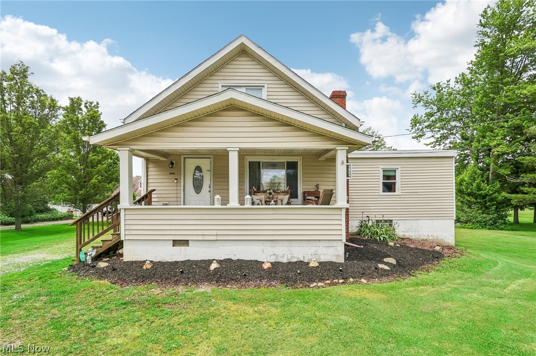 2998 Massillon Road Akron, OH 44312 - Photo 27 of 36 View of front of home with a front lawn and a porch