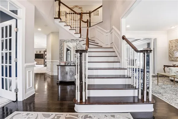 a view of entryway livingroom and hall with wooden floor