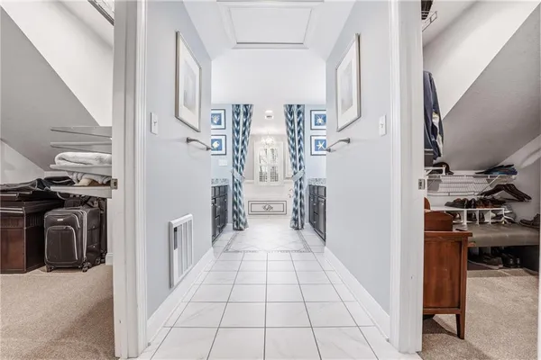 a view of a hallway to a livingroom and a fireplace
