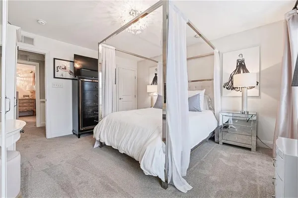 a bed room with a bed and a lamp