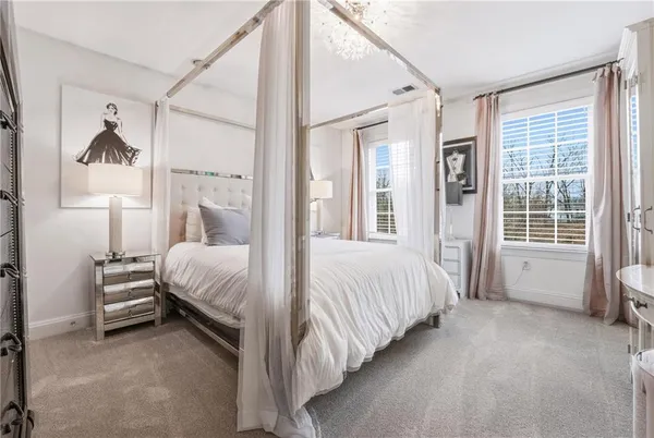 a bed room with a bed and a large window