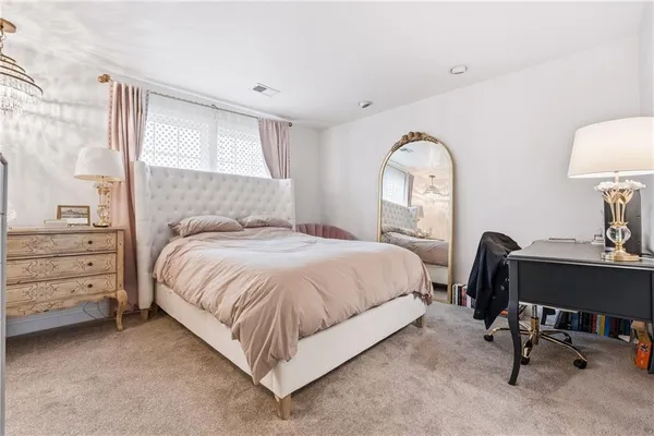 a bedroom with a bed and a table