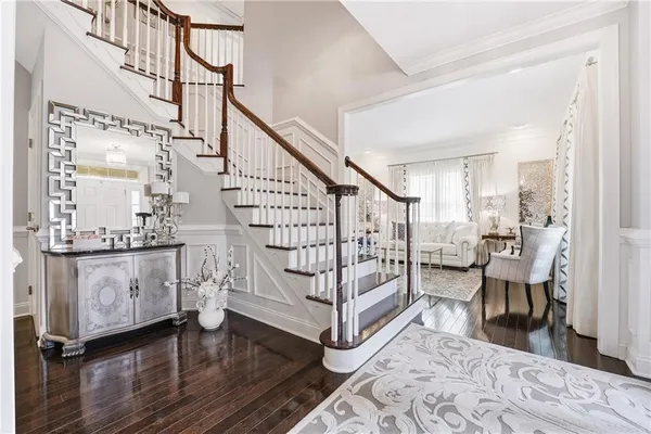 a view of entryway dining room and hall with wooden floor