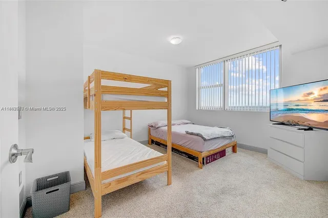 a bedroom with furniture and a tub