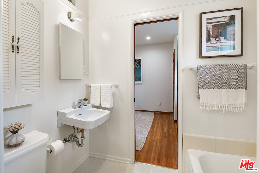 27280 Eastvale Road Palos Verdes Peninsula, CA 90274 - Photo 22 of 34 a bathroom with a sink and a mirror
