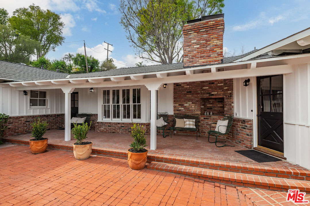 27280 Eastvale Road Palos Verdes Peninsula, CA 90274 - Photo 30 of 34 a view of a house with sitting area and garden