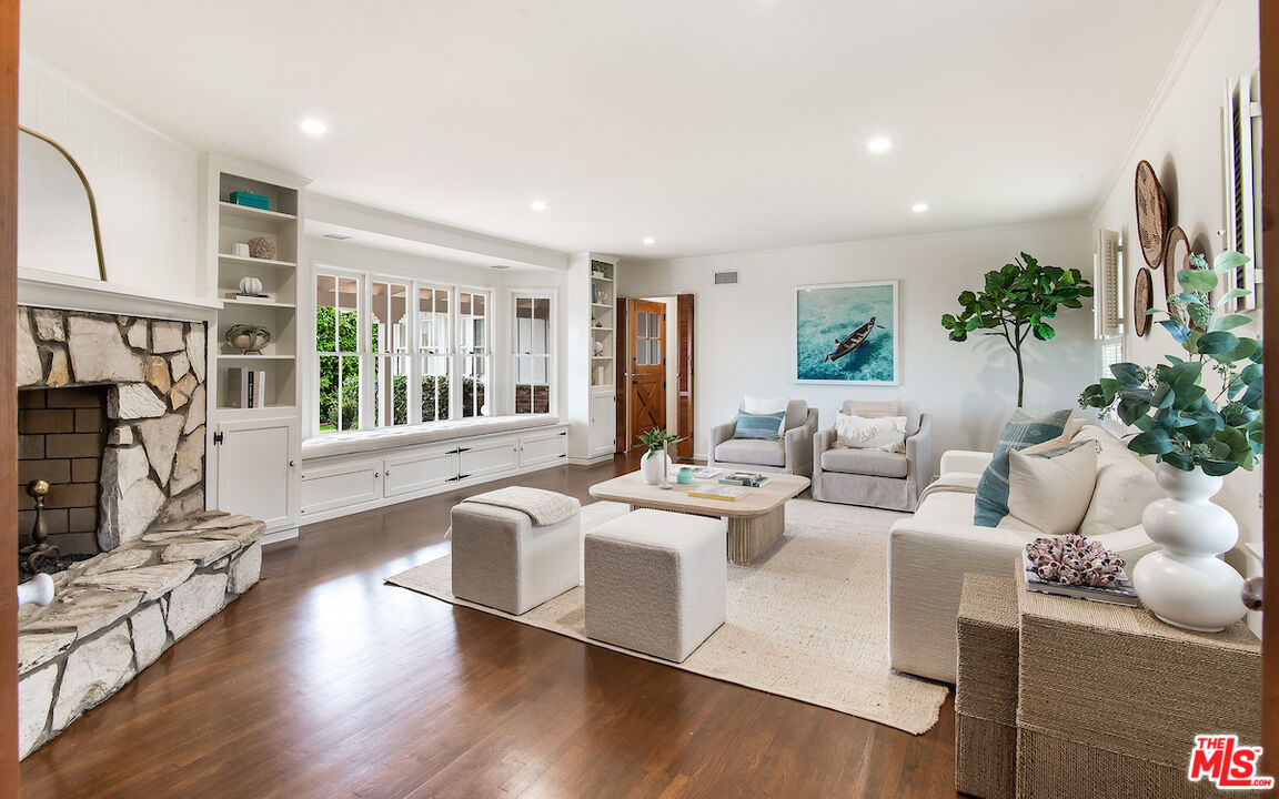 27280 Eastvale Road Palos Verdes Peninsula, CA 90274 - Photo 8 of 34 a living room with furniture large window and wooden floor