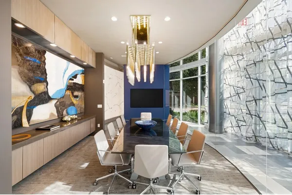 a room with gym equipment and large mirror