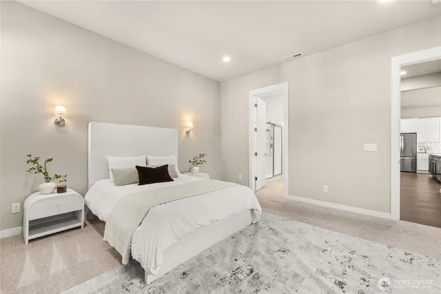 a bedroom with a bed and a potted plant