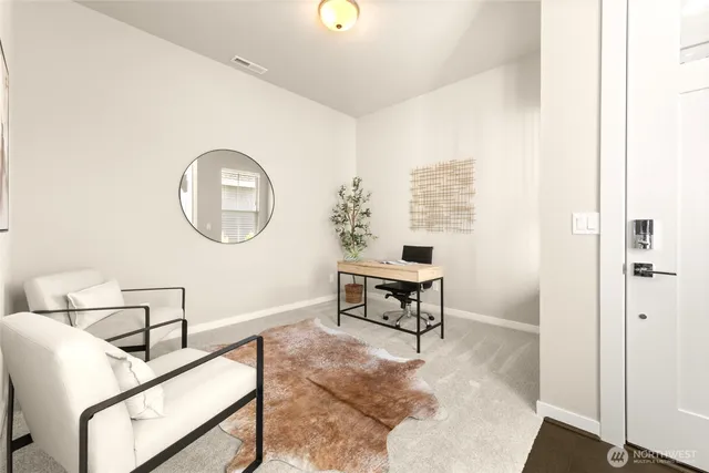 a living room with furniture a mirror and a table