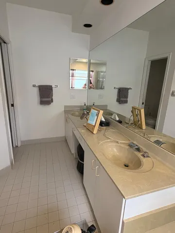 a kitchen with a sink and a stove top oven