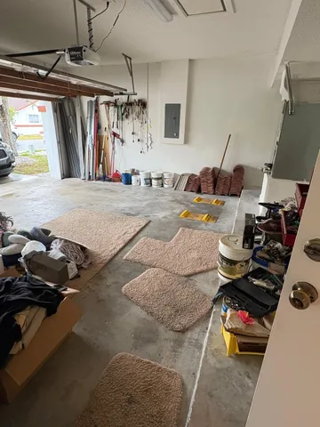 a gym room with furniture and a window