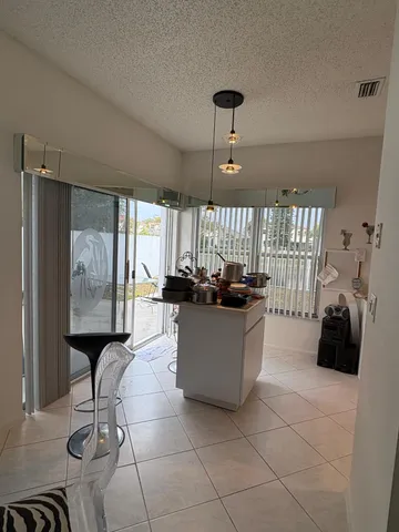 a room with a large window and furniture