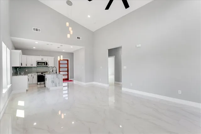 an entryway in a room with a kitchen view