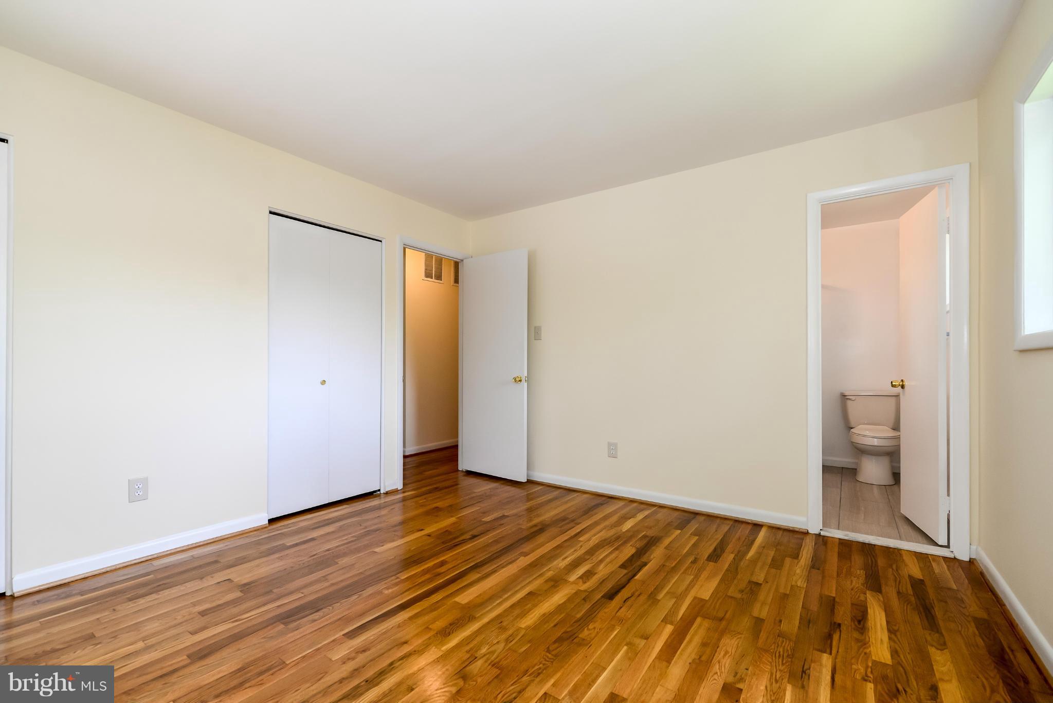 3918 Elby Street Silver Spring, MD 20906 - Photo 15 of 23 a view of an empty room with wooden floor