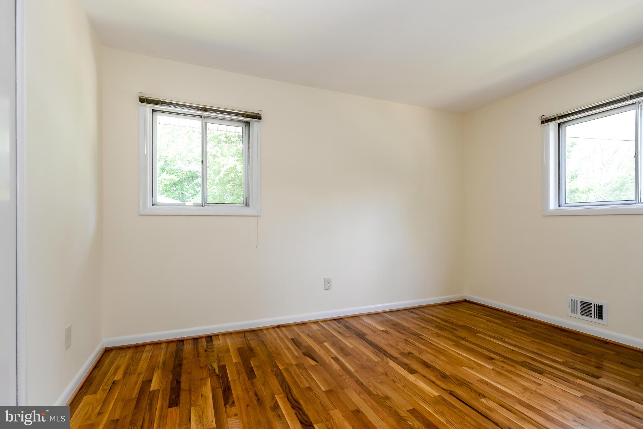 3918 Elby Street Silver Spring, MD 20906 - Photo 19 of 23 a view of empty room with wooden floor and fan