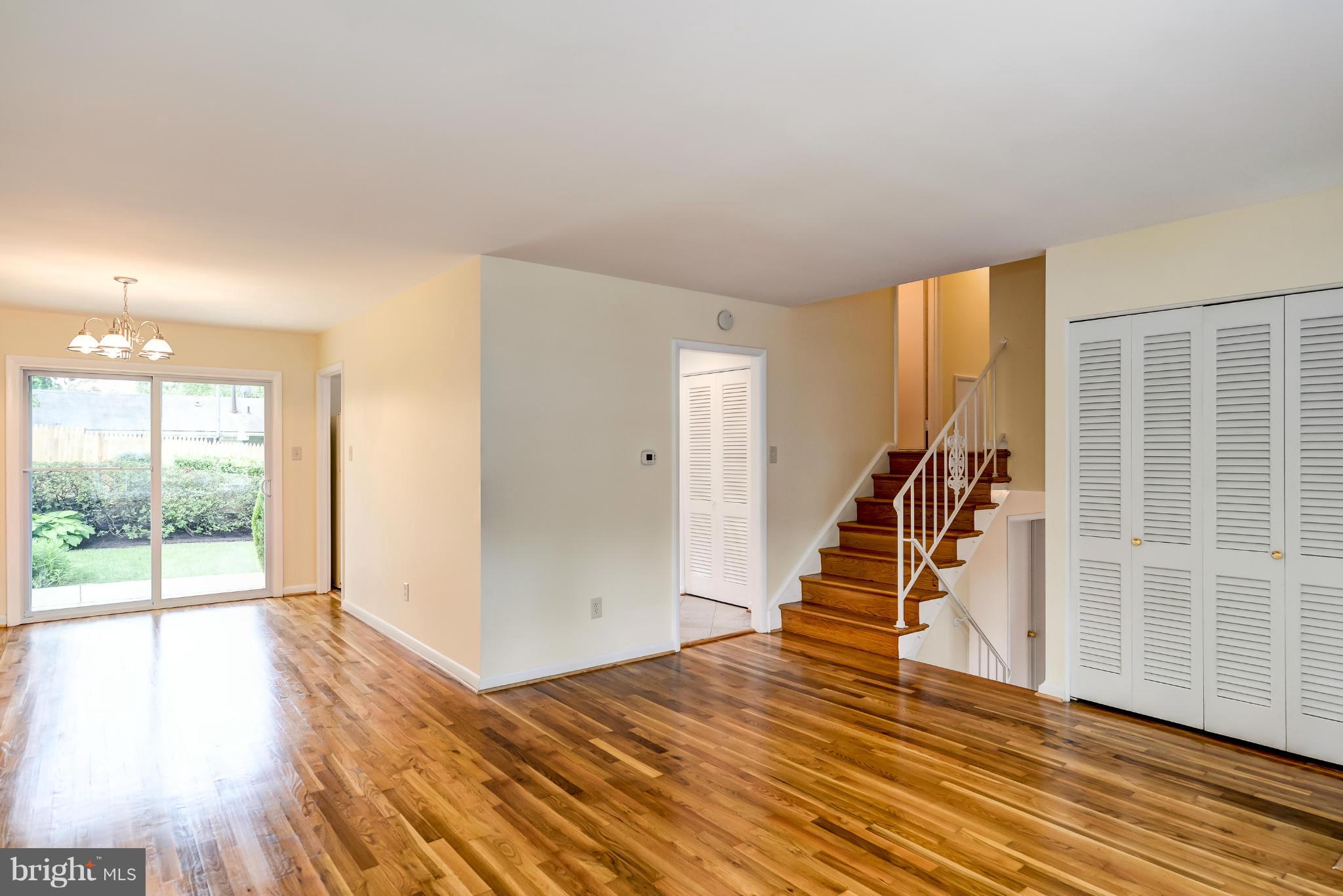 3918 Elby Street Silver Spring, MD 20906 - Photo 3 of 23 a view of a livingroom with wooden floor and stairs