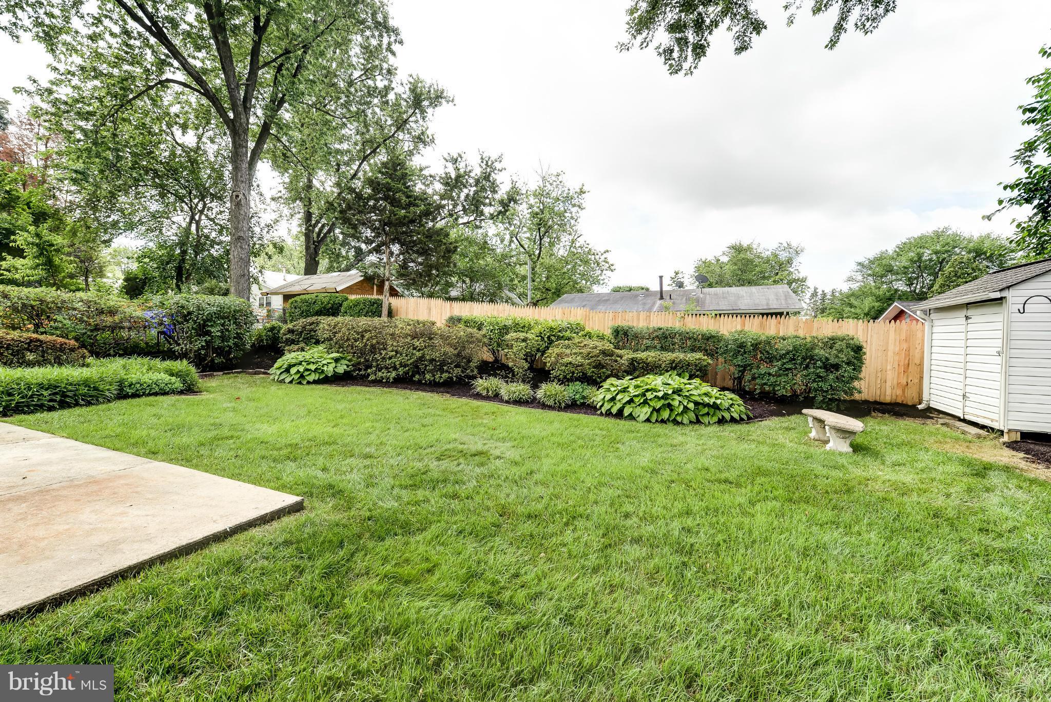 3918 Elby Street Silver Spring, MD 20906 - Photo 22 of 23 a view of a garden with large trees