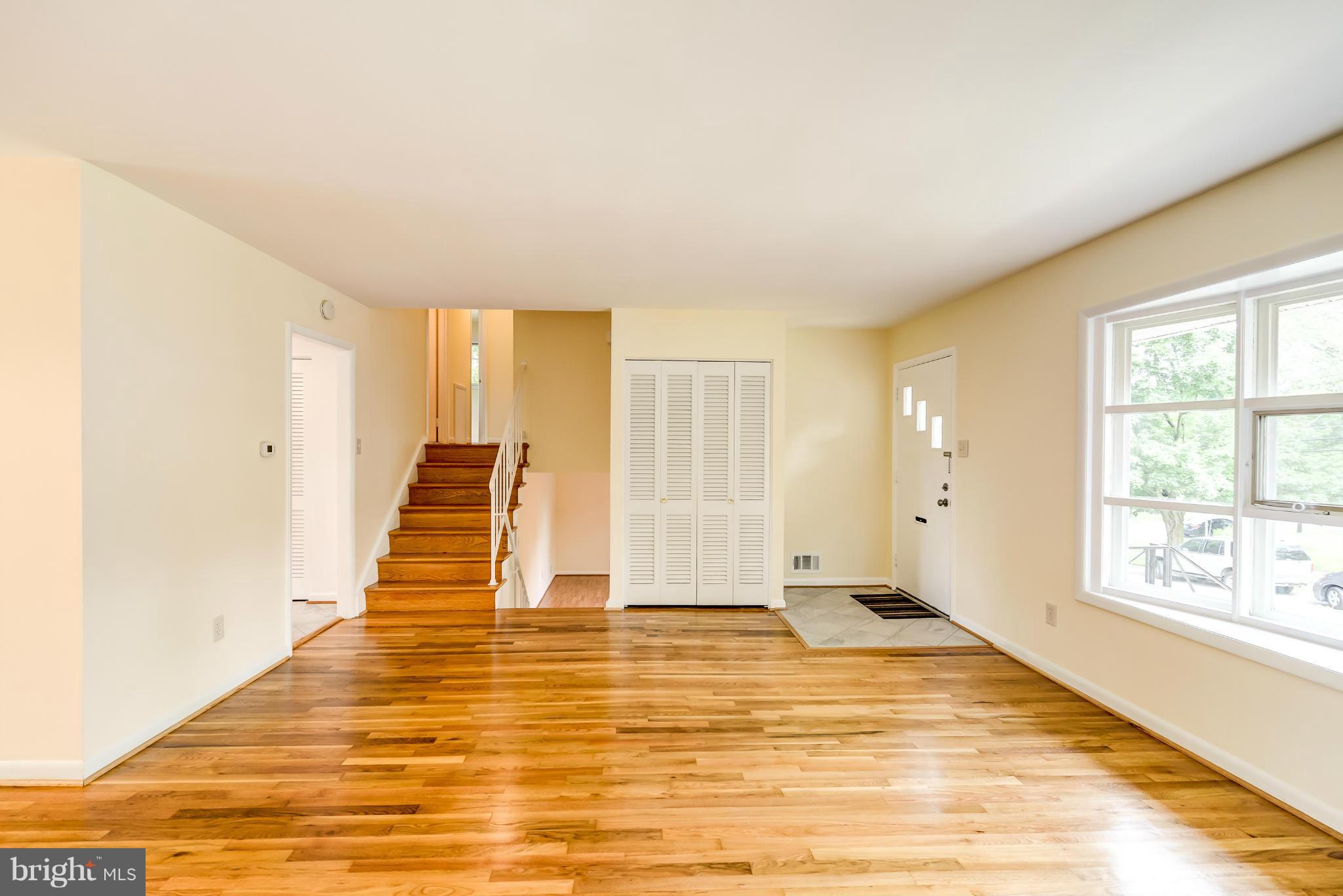 3918 Elby Street Silver Spring, MD 20906 - Photo 10 of 23 a view of an empty room with wooden floor and a window