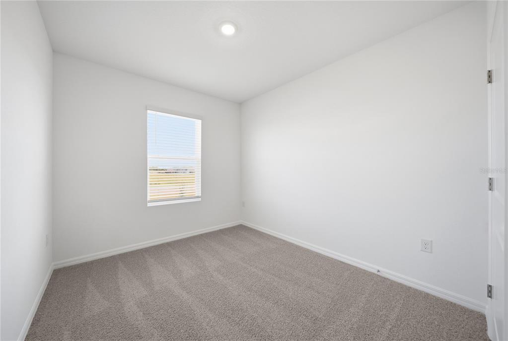 2480 Riversong Ldg Lane Wesley Chapel, FL 33543 - Photo 19 of 30 an empty room with a window