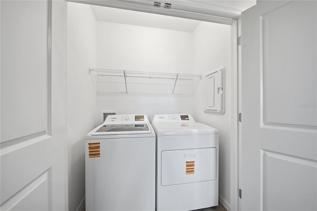 2480 Riversong Ldg Lane Wesley Chapel, FL 33543 - Photo 23 of 30 a utility room with dryer and washer