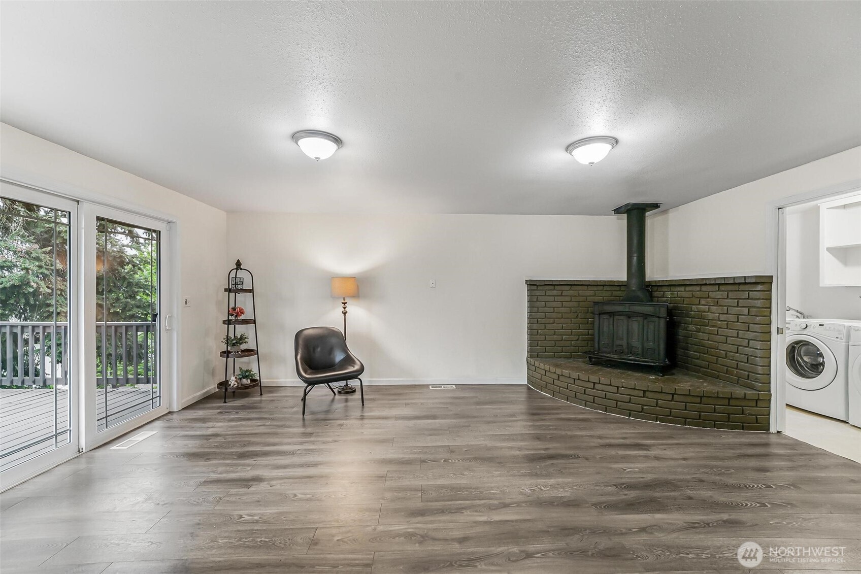 11404 Karshner Road East Edgewood, WA 98372 - Photo 15 of 40 a living room with furniture and a fireplace