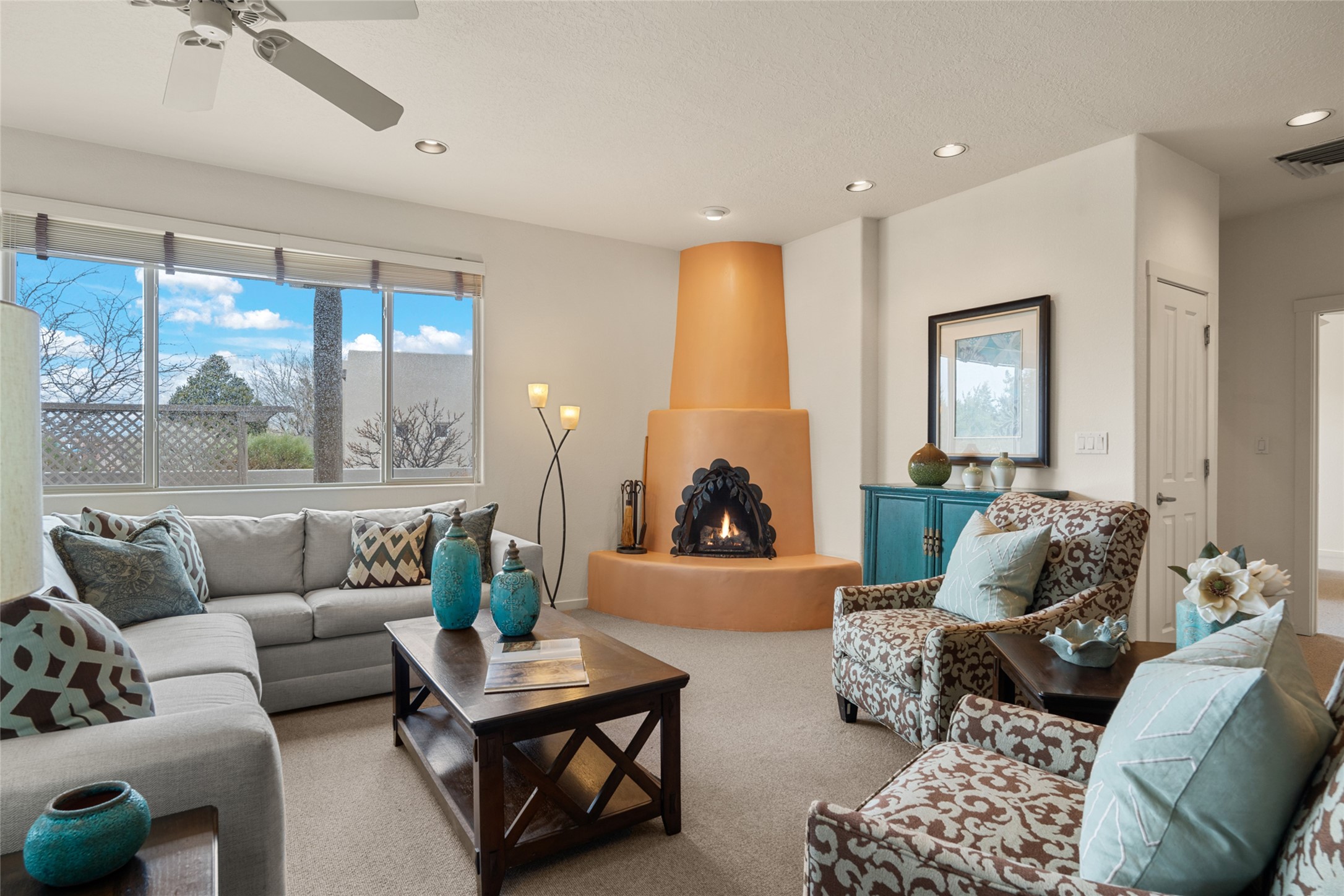 4 Ocotillo Place Santa Fe, NM 87508 - Photo 1 of 1 Welcome to 4 Ocotillo Place in Rancho Viejo - Living Room w/ corner Kiva Fireplace