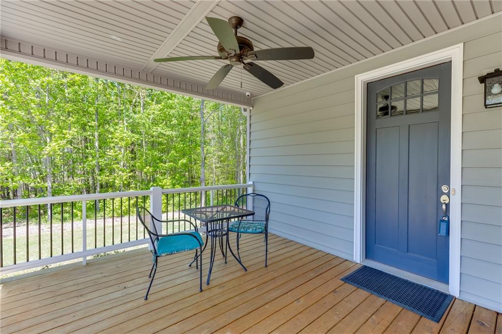 7660 Fern Lane Lula, GA 30554 - Photo 4 of 50 a view of a deck with wooden floor and outdoor space