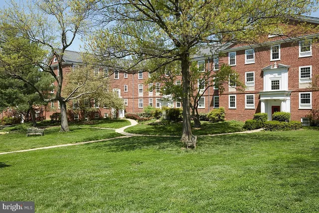 a view of a building with a yard