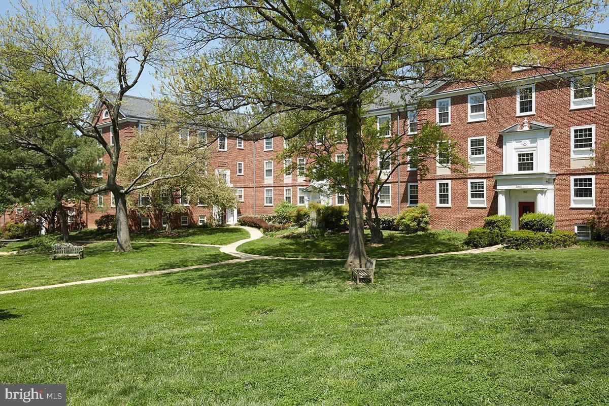 3880 Rodman Street Northwest, Unit C213 Washington, DC 20016 - Photo 14 of 32 a view of a building with a yard