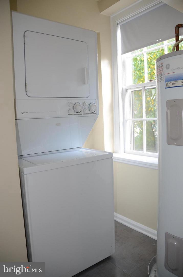 3880 Rodman Street Northwest, Unit C213 Washington, DC 20016 - Photo 6 of 32 a view of washer and dryer with a glass door