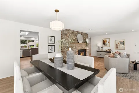 a living room with fireplace furniture and a wooden floor