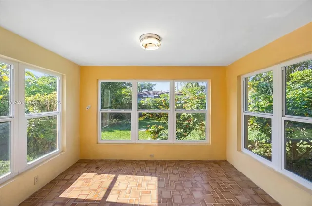 a view of workspace with large windows