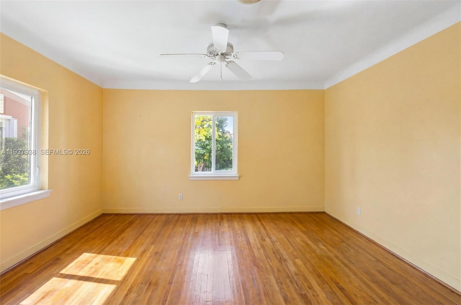 9148 Abbott Avenue Surfside, FL 33154 - Photo 26 of 39 wooden floor in an empty room with a window