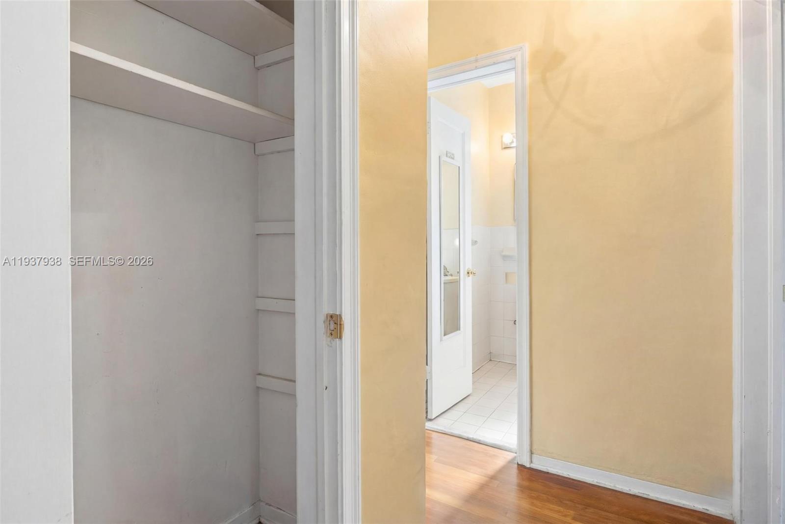 9148 Abbott Avenue Surfside, FL 33154 - Photo 26 of 37 a view of a hallway with wooden floor
