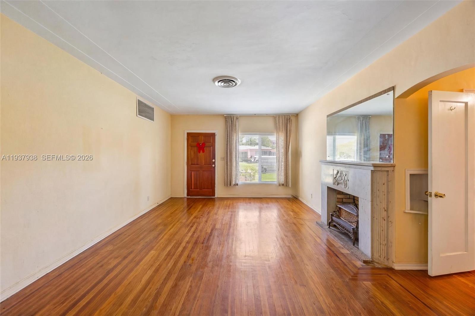 9148 Abbott Avenue Surfside, FL 33154 - Photo 31 of 37 a view of an empty room with window and wooden floor