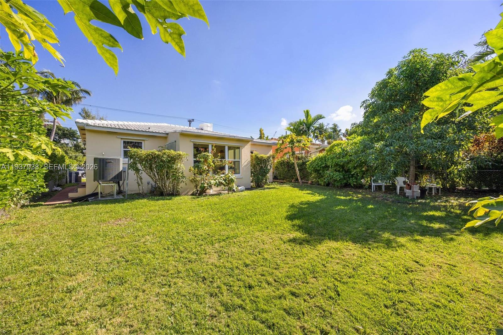 9148 Abbott Avenue Surfside, FL 33154 - Photo 10 of 39 a view of a back yard of the house