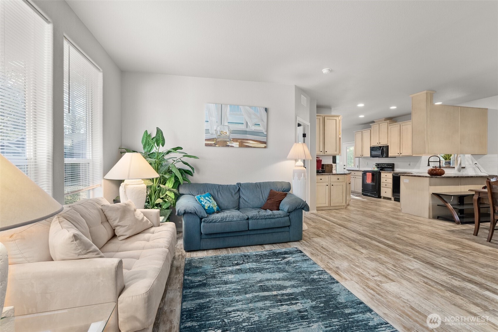4 Lakeview Lane South Bend, WA 98586 - Photo 18 of 40 a living room with furniture and a dining table with kitchen view