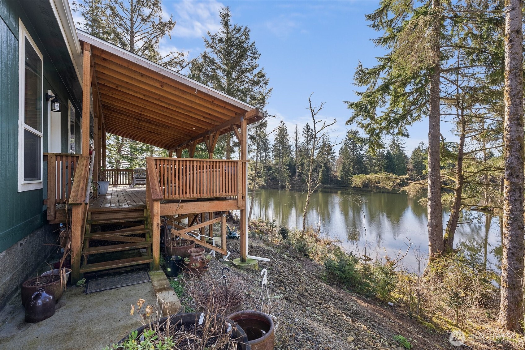 4 Lakeview Lane South Bend, WA 98586 - Photo 34 of 40 a view of a backyard with plants and a lake view