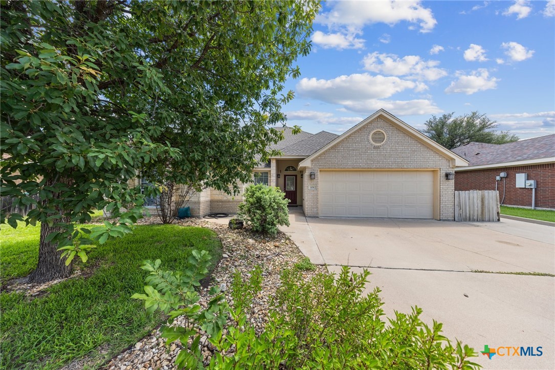 108 Gehler Circle Nolanville, TX 76559 - Photo 1 of 27 a front view of a house with garden